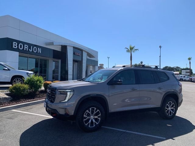 2026 GMC Acadia AT4 in Riverstone Metallic — front three-quarter view