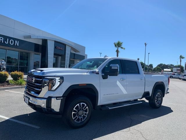 2026 GMC Sierra 2500 HD SLT in Summit White — front three-quarter view