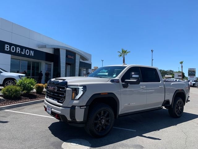 2026 GMC Sierra 2500 HD AT4 in Coastal Dune — front three-quarter view