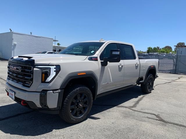 2026 GMC Sierra 2500 HD AT4 in Coastal Dune — front three-quarter view