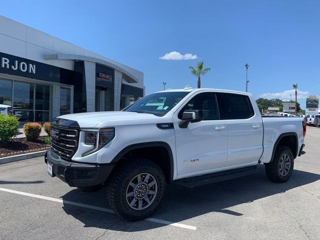 2026 GMC Sierra 1500 AT4X in Summit White — front three-quarter view