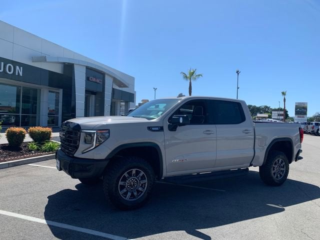 2026 GMC Sierra 1500 AT4X in Coastal Dune — front three-quarter view