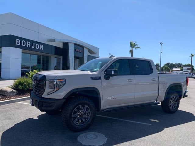 2026 GMC Sierra 1500 AT4X in Coastal Dune — front three-quarter view