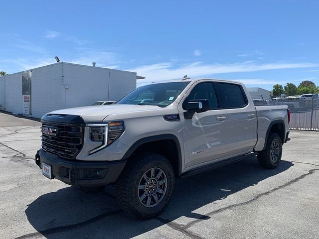 2026 GMC Sierra 1500 AT4X in Coastal Dune — front three-quarter view