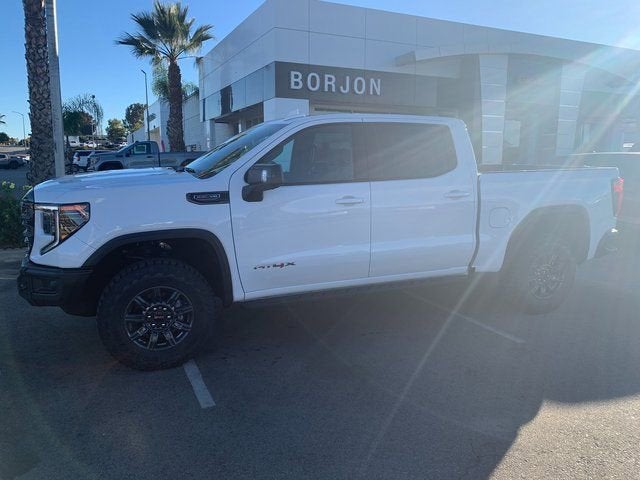 2026 GMC Sierra 1500 AT4X in Summit White — front three-quarter view